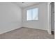 Bedroom featuring neutral carpet and large bright window at 6832 Upland Heights Ave, Las Vegas, NV 89142