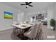 Staged dining room featuring a white marble table with seating for six and bright decor at 6832 Upland Heights Ave, Las Vegas, NV 89142