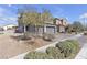 Two-story house with a gray exterior and a well-kept yard at 6832 Upland Heights Ave, Las Vegas, NV 89142