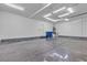 Finished garage with epoxy floors, overhead lighting, and ample space for storage and vehicles at 6832 Upland Heights Ave, Las Vegas, NV 89142