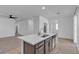 Kitchen island with stainless steel dishwasher, sink, and faucet; open layout and ample lighting at 6832 Upland Heights Ave, Las Vegas, NV 89142