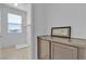 Efficient laundry room features neutral cabinets and abundant natural light at 6832 Upland Heights Ave, Las Vegas, NV 89142