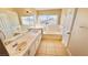 Bright bathroom with double sinks, bathtub, and ample counter space at 7244 Buglehorn St, Las Vegas, NV 89131