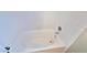 Clean white bathtub with tile surround at 7244 Buglehorn St, Las Vegas, NV 89131