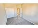 Bedroom with neutral walls, carpet, and a closet with sliding doors at 7244 Buglehorn St, Las Vegas, NV 89131