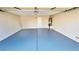 Spacious garage with epoxy flooring, painted walls, and automatic door at 7244 Buglehorn St, Las Vegas, NV 89131