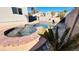 Private pool and spa featuring a rock waterfall and mature landscaping at 7244 Buglehorn St, Las Vegas, NV 89131