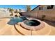 Beautiful backyard pool and spa area features rock waterfall feature and privacy wall at 7244 Buglehorn St, Las Vegas, NV 89131