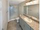 Bathroom with a shower, toilet, and vanity with granite countertops at 7325 Sunray Point St, North Las Vegas, NV 89084