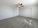 Spacious bedroom with modern ceiling fan and neutral carpeting at 7325 Sunray Point St, North Las Vegas, NV 89084