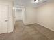 Upper-level carpeted hall area with two doors and neutral paint at 7325 Sunray Point St, North Las Vegas, NV 89084