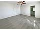 Bedroom with a ceiling fan, and a door leading to an ensuite bathroom at 7325 Sunray Point St, North Las Vegas, NV 89084