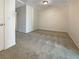 A carpeted bedroom features neutral colors and a ceiling light at 7325 Sunray Point St, North Las Vegas, NV 89084