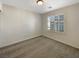 Bedroom featuring a window with white shutters and neutral carpeting at 7325 Sunray Point St, North Las Vegas, NV 89084