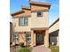 Exterior view of a modern two-story home with desert landscaping at 7325 Sunray Point St, North Las Vegas, NV 89084