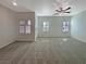 Bright living room illuminated by natural light and featuring a ceiling fan at 7325 Sunray Point St, North Las Vegas, NV 89084