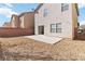 Backyard featuring a concrete patio, low-maintenance landscaping, and a brick wall at 7452 Wine Creek St, Las Vegas, NV 89139