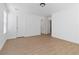 Bedroom featuring wood-look flooring with white walls and two entry doors at 7452 Wine Creek St, Las Vegas, NV 89139