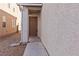 Inviting front entrance with a solid wood door and modern hardware at 7452 Wine Creek St, Las Vegas, NV 89139