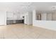 Bright open-concept kitchen features gray lower cabinets and stainless steel appliances at 7452 Wine Creek St, Las Vegas, NV 89139