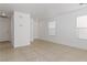 Bright living room with neutral tile flooring and all-white walls at 7452 Wine Creek St, Las Vegas, NV 89139