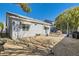 Fenced backyard with gravel, a swing set, and a view of the home's exterior at 7835 Meandering Path Ave, Las Vegas, NV 89131