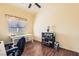 Bright bedroom featuring wood-look flooring, neutral walls, and a decorative chest of drawers at 7835 Meandering Path Ave, Las Vegas, NV 89131