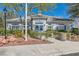 Exterior view of community center with well-maintained landscaping, accessible ramp, and clear signage at 7835 Meandering Path Ave, Las Vegas, NV 89131