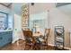 Charming dining nook with wood table and chairs, complemented by natural light at 7835 Meandering Path Ave, Las Vegas, NV 89131