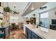 Open-concept kitchen with light tile countertops and views of the dining area at 7835 Meandering Path Ave, Las Vegas, NV 89131