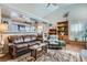 Comfortable living room showcasing seamless flow to kitchen and dining space at 7835 Meandering Path Ave, Las Vegas, NV 89131