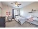 Bright bedroom with modern hanging chair, desk, and cozy decor for relaxation and study at 9037 Wolf Dancer Ave, Las Vegas, NV 89143