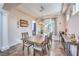 Dining room featuring neutral paint, modern lighting, and tiled flooring at 9037 Wolf Dancer Ave, Las Vegas, NV 89143