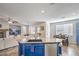 Bright kitchen island featuring bar stool seating and views of the living room area at 9037 Wolf Dancer Ave, Las Vegas, NV 89143