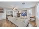 Comfortable living area with a cozy fireplace, tiled flooring, and neutral decor at 9037 Wolf Dancer Ave, Las Vegas, NV 89143