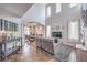 Open-concept living room with high ceilings, tile floors, and flows into the dining area at 9037 Wolf Dancer Ave, Las Vegas, NV 89143