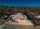 Aerial view of the property showcasing the pool, outdoor space, and its location within the neighborhood and surrounding environment at 9091 Becket Ranch Ct, Las Vegas, NV 89113