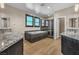 Modern bathroom featuring dual vanities, a soaking tub, and a glass-enclosed shower at 9091 Becket Ranch Ct, Las Vegas, NV 89113