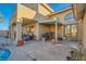 Private back patio with outdoor cooking area, seating, and pergola at 9532 Cliff View Way, Las Vegas, NV 89117