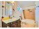 This bathroom features unique rustic finishes, light countertops, and a tiled shower/tub combo at 9532 Cliff View Way, Las Vegas, NV 89117