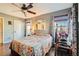 Comfortable bedroom featuring a ceiling fan and a bright window for natural light at 9532 Cliff View Way, Las Vegas, NV 89117