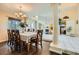 Elegant dining room with hardwood floors and views of the living room at 9532 Cliff View Way, Las Vegas, NV 89117