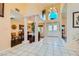 Spacious foyer with tile flooring, high ceilings, and views of the dining room at 9532 Cliff View Way, Las Vegas, NV 89117