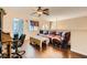 Spacious living room featuring hardwood floors, a large sofa, and a well-lit media center at 9532 Cliff View Way, Las Vegas, NV 89117