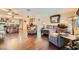 Open-concept living room with hardwood floors and a view of the kitchen at 9532 Cliff View Way, Las Vegas, NV 89117