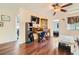 Inviting living room with hardwood floors, media center and plenty of natural light at 9532 Cliff View Way, Las Vegas, NV 89117