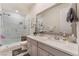 Elegant bathroom featuring a glass shower and gray vanity with plenty of counter space at 10438 Skye Arroyo Ave, Las Vegas, NV 89166
