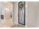 Inviting entryway features decorative glass door and sidelight with views into the home's open layout at 10438 Skye Arroyo Ave, Las Vegas, NV 89166