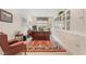 Home office with large desk, built-in cabinets, and comfortable leather chair at 10438 Skye Arroyo Ave, Las Vegas, NV 89166