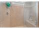 Tiled shower featuring built-in bench, overhead shower, and glass door at 10438 Skye Arroyo Ave, Las Vegas, NV 89166